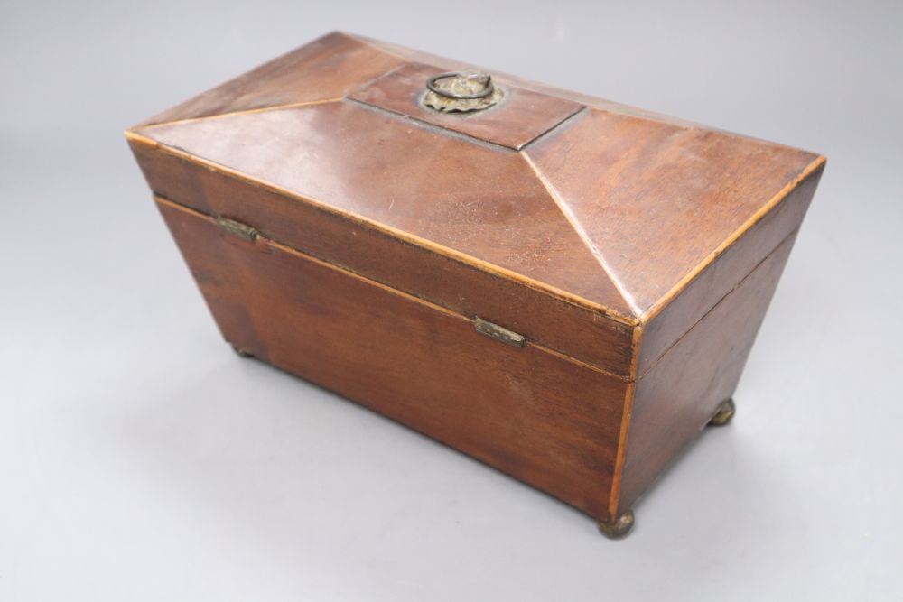 A Georgian mahogany tea caddy with associated mixing bowl and a similar writing slope, longest 35.5cm